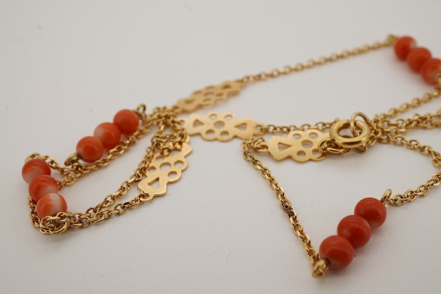 A recent yellow metal and coral bead set necklace, 40cm, gross weight 3 grams. Condition - good